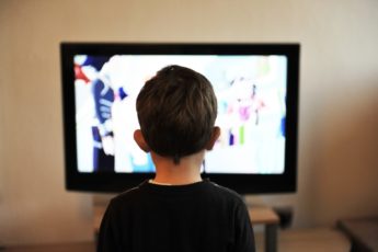 Little boy watching television