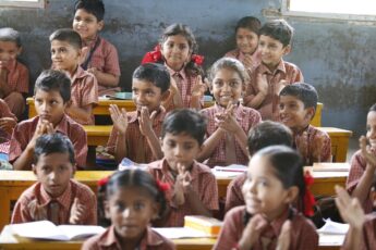 Young children learning foundational skills in a classroom